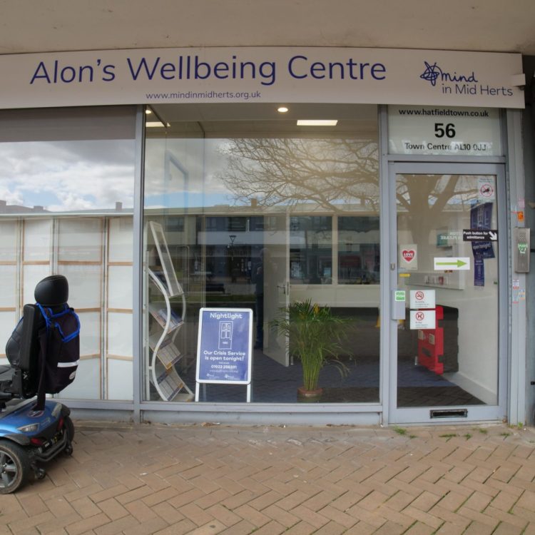 the photo shows an the front entrance of the Hatfield crisis cafe, including glass windows and a glass door